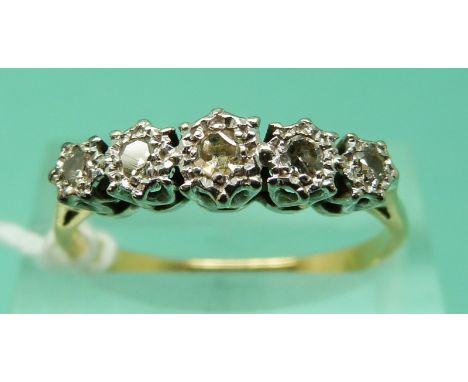 An 18ct gold ring set with five diamonds in a platinum illusion setting (size R), weight 2.91g