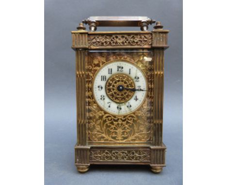 Edwardian brass carriage clock with pierced galleried and fretworked decoration, Arabic ivory coloured chapter ring and black