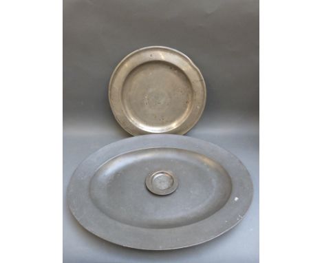 An R Bush & Co oval pewter platter with marks to underside, maximum diameter 53cm, together with two further pewter plates, s