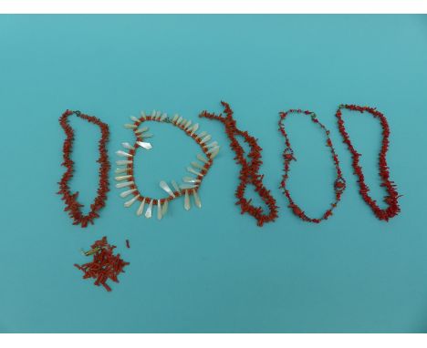 Three coral necklaces and a coral and a mother-of-pearl example