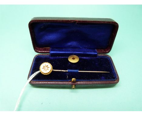 A 15ct gold stud and a 15ct gold stick pin set with a diamond in original box