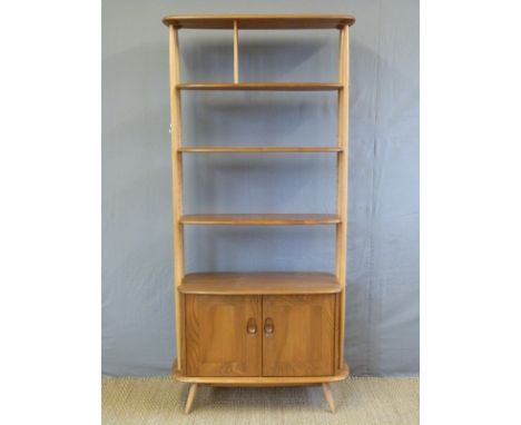 An Ercol light elm room divider with adjustable shelves above single cupboard (W85 x D40 x H191cm)