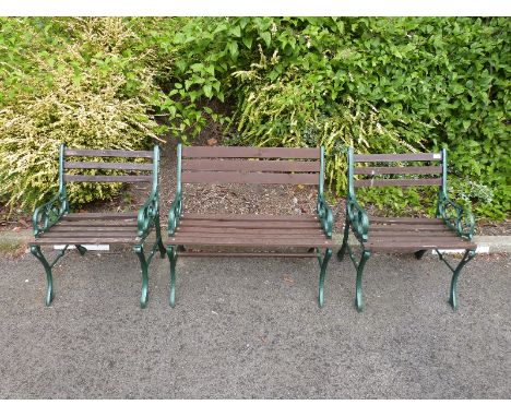 A garden bench and two matching chairs 