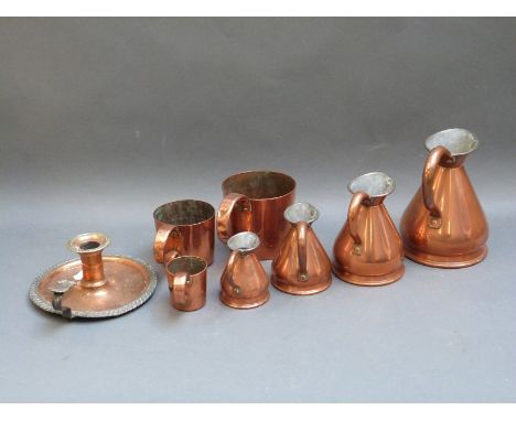 A quantity of 19thC and later copper measures, chamber stick etc