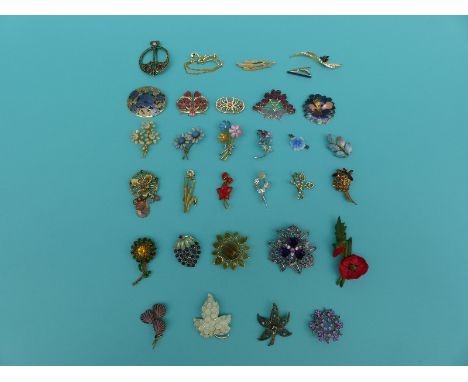 A collection of brooches to include enamel examples, floral and foliate etc