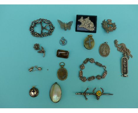 A Victorian mourning locket with black enamel decoration, Victorian locket, silver brooch in the form of a stag's head and sw