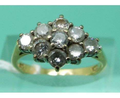 An 18ct gold ring set with round cut diamonds in a cluster, total diamond weight 1ct (size K)