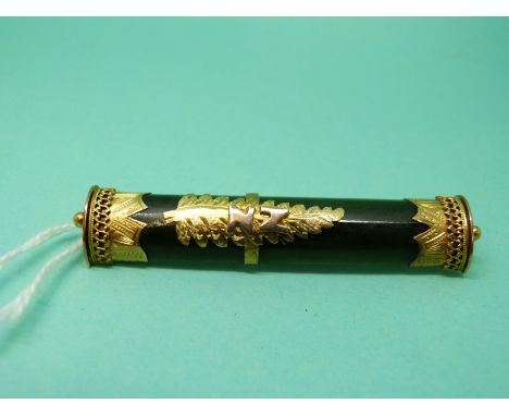 A 9ct gold brooch set with a panel of nephrite jade with a gold fern to the centre and 'NZ'