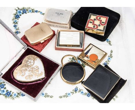 Three Revlon compacts, including a Love Pat refill for oblong compacts in card box, black rectangular slab, 7cm x 6cm in clot