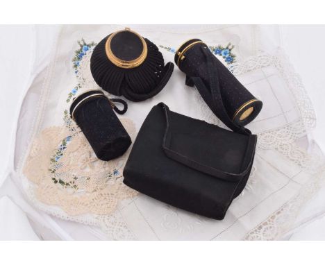Four vintage French black fabric bags, including a 1950s WW Minois vanity handbag, 28cm x 16.5cm, La Vedette de Paris retract
