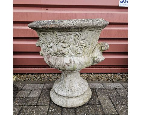 A reconstituted weathered stone garden planter with cherub design, standing at 63cm tall, overall condition is with usual sig