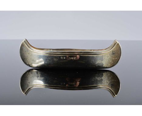 A late Victorian silver model of a canoe, 1.48 ozt and 13cm long, Chester 1898, marks worn and possibly by S. Morden, overall