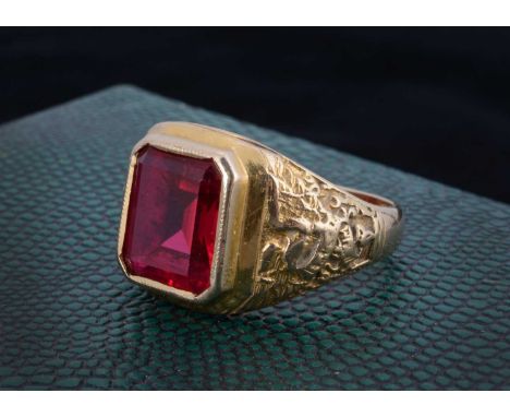 A 9ct gold gentleman's signet ring, set with a synthetic ruby, ring size S 1/2, 7.6g