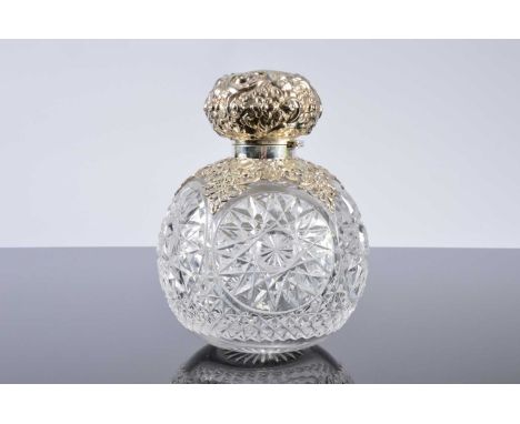 A large Edwardian cut glass and silver mounted scent bottle by William Hutton & Son, 17cm high, with hinged cap and small cut