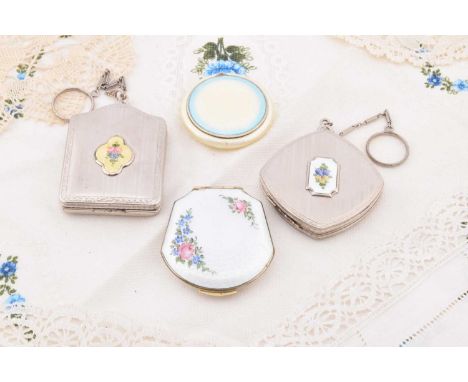 Four FMCO 1920s or 1930s compacts, including a circular white and blue guilloche enamelled example, 5cm diameter, a domed rec