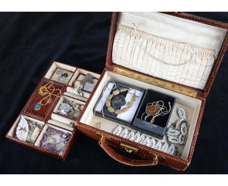 A collection of silver jewels, including a suite of Siam silver and enamel jewels, a mother of pearl turtle brooch, a carved 
