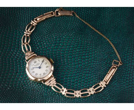 A lady's Bentima manual wind wristwatch, in gold plated case, on 9ct gold strap