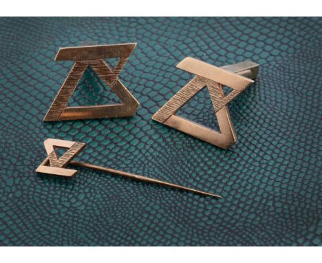 A cufflink and tie pin set in 9ct gold, stylised monogram, 12.5g