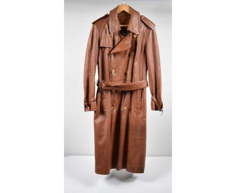 A vintage leather trench coat by Burberry, in light brown, double breasted with epaulets and waist belt.