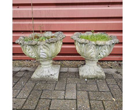 Two reconstituted weathered stone urn garden planter, both standing at 45cm tall, good condition with usual signs of wear