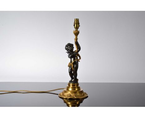 A nice modern gilt metal and bronzed figure lamp base, in the classical taste and modelled as a cherub on circular base suppo