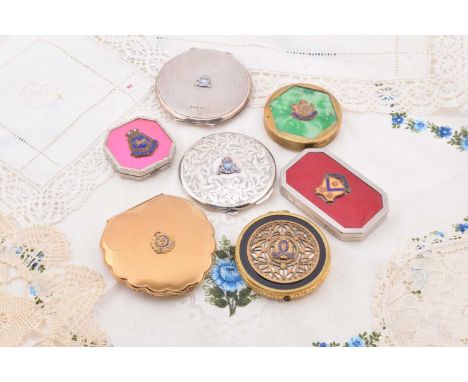 Four Royal Canadian compacts, including a circular Royal Canadian Air Force with insignia in coloured enamels in relief and m