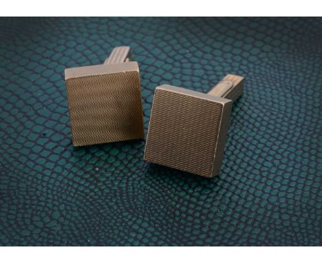 A pair of 9ct gold engine turned cufflinks, with square block fronts and snap backs, 1.4cm, 30g