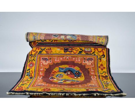An early 20th century Chinese temple carpet, 160cm by 82cm, overall in good condition but some signs of wear and usage