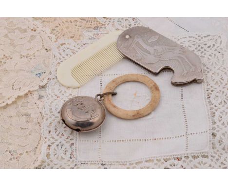 A baby folding comb, hinged with chromed case decorated with nursery scenes 9.5cm folded and a Victorian circular baby teethi