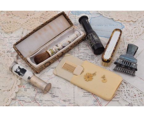An art deco celluloid cased handbag comb and mirror, with relief floral decoration of rectangular form, 7cm x 5cm, a retracta
