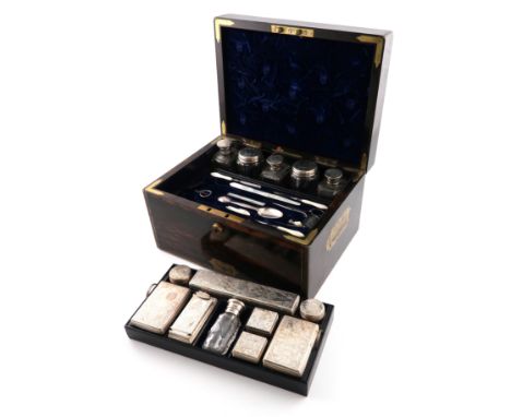 A Victorian silver mounted travelling dressing table set, the mounts by Frances Douglas, London 1853, manufactured by Bayley,