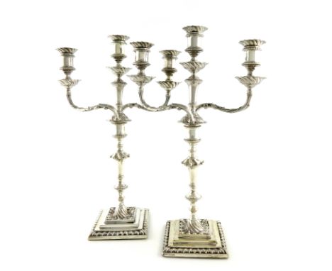 A pair of Victorian silver three-light candelabra, by Hawksworth, Eyre &amp; Co Ltd, Sheffield 1894, knopped columns, spool-s