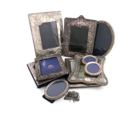 A large collection of silver photograph frames, various dates and makers, including a rectangular one by Mappin and Webb, Bir