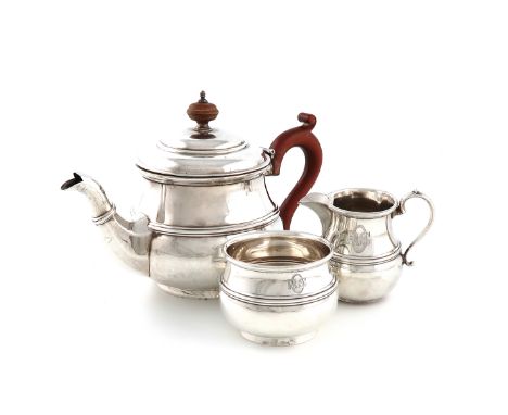 A three-piece silver tea set, by W Drummond &amp; Co., (retailers Melbourne Australia), London 1924, circular bellied form, s