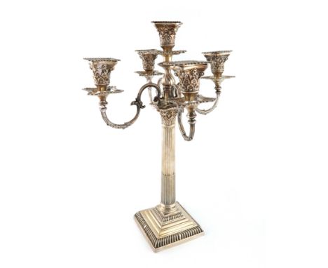 An Edwardian silver five-light candelabrum. by Mappin and Webb, Sheffield 1907, Corinthian column form, on a stepped square b