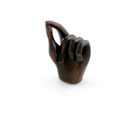 A 19th century novelty carved treen snuff box, carved as a hand taking just a pinch of snuff, hinged cork lined cover, length