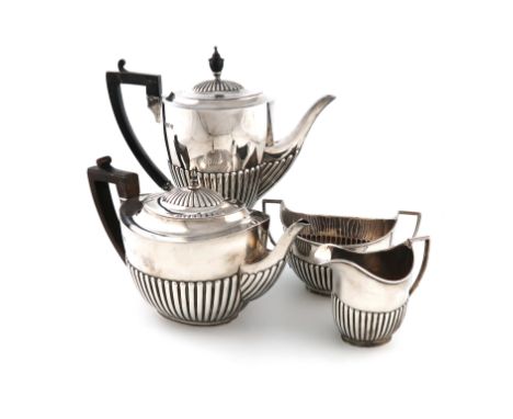 A matched four-piece late-Victorian silver tea and coffee set, by William Hutton and Sons, London 1899/1900 and Sheffield 190