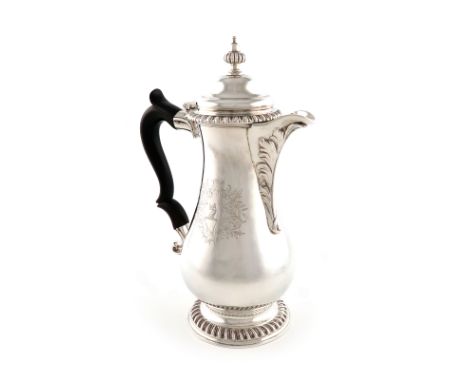 A George III silver hot water jug, Thomas Whipham and Charles Wright, London 1767, baluster form, scroll handle, engraved wit