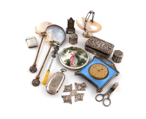 A mixed lot of objects of vertu, comprising silver items: a silver-mounted blue enamel clock, London 1926, a silver and mothe