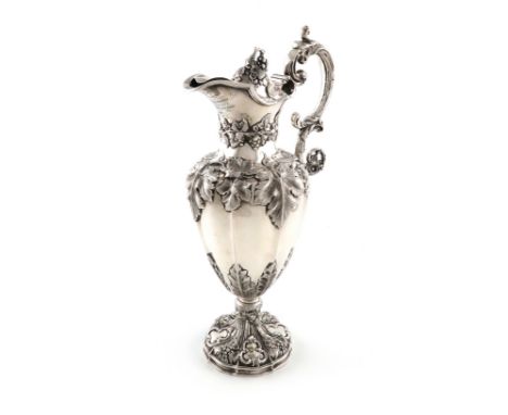 A Victorian silver ewer, by Henry Wilkinson and Co., Sheffield 1855, lobed baluster form, embossed with trailing vines, leaf 