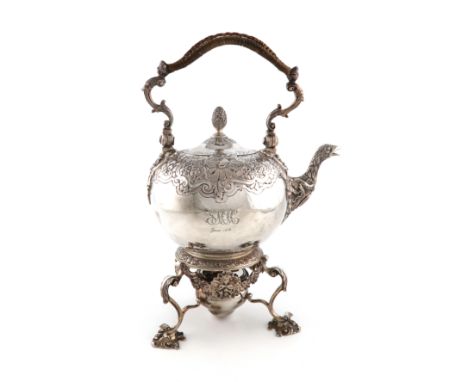 A silver kettle on stand, by Charles Stuart Harris, London 1910, circular form, chased foliate decoration, flush-hinged cover