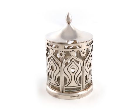 By Grant McDonald, a modern silver preserve jar and cover, London 2007, cylindrical form, pierced with stylised towers and st