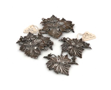 A pair of William IV silver vine leaf wine labels, by Joseph Willmore, Birmingham 1833, pierced 'LIGHT WINE' and 'MADEIRA', p