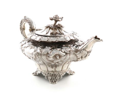 λA George IV silver bachelor's tea pot, by Charles Fox, London 1829, circular tapering form, embossed foliate decoration, fol