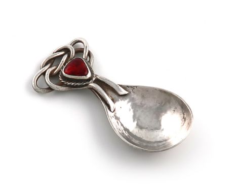 By Omar Ramsden, an Arts and Crafts silver and enamel caddy spoon, London 1927, spot-hammered fig-shaped bowl, intertwined wi