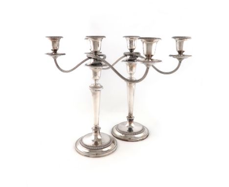 A pair of modern silver three-light candelabra, by Roberts and Belk, Sheffield 1970, tapering circular form, gadroon borders,