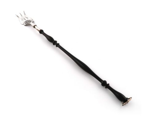 A silver toasting fork, by Thomas Bradbury and Son, Sheffield 1922, the three tines with pierced foliate scroll decoration, t