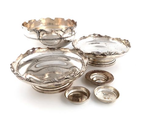 A silver rose bowl and pair of similar dishes ensuite, by Roberts &amp; Dore, Birmingham 1936/37, circular form, castellated 