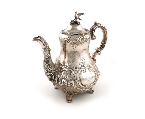 λA Victorian silver coffee pot, by Savory and Sons, London 1864, baluster form, embossed foliate scroll decoration, the scrol