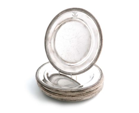 A set of twelve silver plates, by D and J Wellby, London 1931, circular form, gadroon border, engraved with a crest, diameter